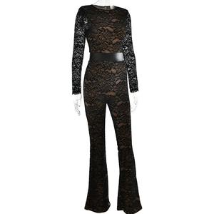 Close-up of black lace long sleeve bodysuit with leather waist belt and nude lining