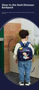 Detail of navy blue dinosaur backpack for kids with glowing crown and guitar graphic