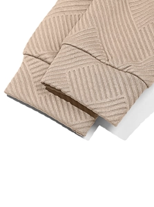 Detail of khaki men's hoodie featuring ribbed cuffs and geometric twill knit texture