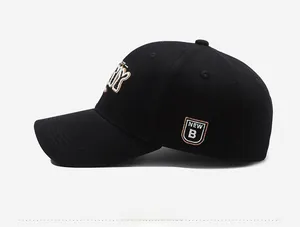 Detailed close-up of side embroidery patch and quality stitching on black baseball cap