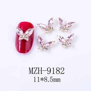 Detail of 3D butterfly nail charms with pink crystal and gold base, size 11x8.5mm