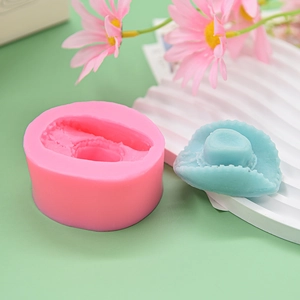 Pink cowboy hat silicone mold for DIY fondant and chocolate baking with blue sample piece