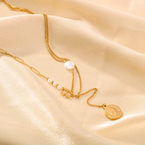 Gold double-layer necklace with Baroque pearl, letter B pendant, and coin portrait charm