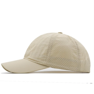 Close-up of beige quick-dry baseball cap featuring breathable perforated mesh fabric