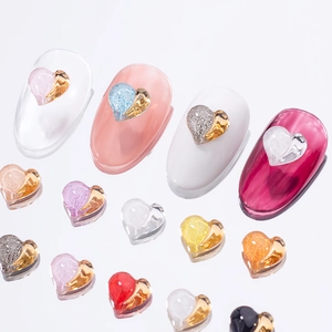 Chic heart-shaped nail charms with metal edges and resin glitter for DIY manicure