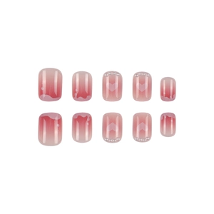 Pink gradient press-on nails with heart patterns and pearls in a short square shape