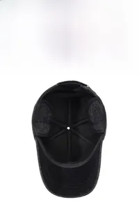Detail view of winter baseball cap with warm black fleece lining and protective ear flaps