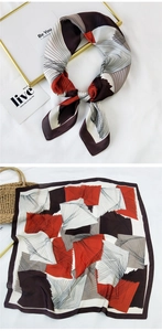 Close-up of square silk scarf with red and black geometric lines in tied and flat views