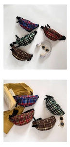 Detailed flat lay of plaid canvas waist bags in various colors for kids fashion