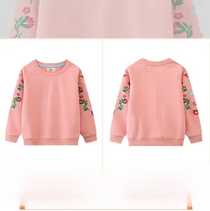 Detailed embroidery of colorful flowers on sleeves of pink knit cotton kids sweatshirt