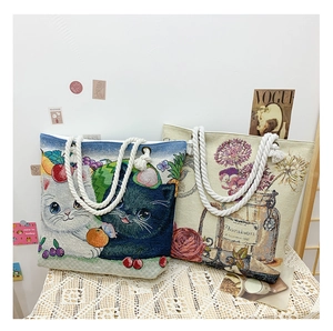 Detailed embroidery texture on double-sided jacquard tote bags with rope handles