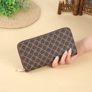 Women's long brown leather wallet with floral monogram pattern and gold zippers