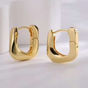 Minimalist geometric U-shaped earrings in polished gold finish for a modern look