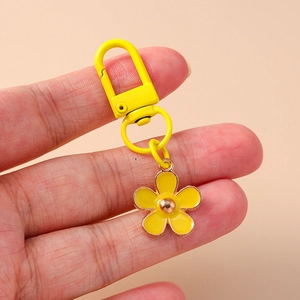 Floral enamel keychain with five-petal yellow flower charm and metal ring for bags