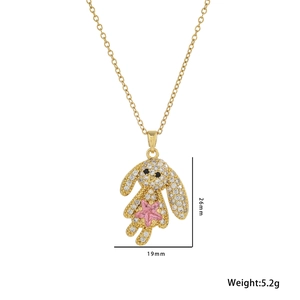 Golden rabbit pendant necklace with pink star stone and white zircons on white background