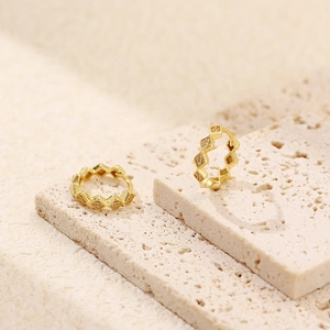 Macro shot of S925 hallmark on gold plated geometric rhombus zircon earrings