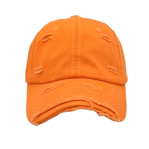 Detailed view of the bright orange cotton canvas baseball cap with vintage distressed holes