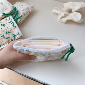 Floral cotton coin purse detail showing inner capacity for sanitary pads storage