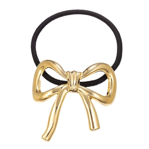Elastic hair tie with a large metallic gold bow charm and a polished mirror finish