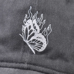 Washed cotton baseball cap with white butterfly flame print and street style details