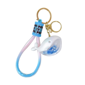 Cute white dolphin keychain with blue star sequins and pink-blue gradient wristband