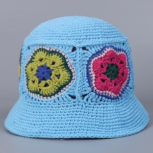 Detailed close-up of handmade crochet bucket hat with colorful flower patterns