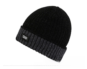 Close-up of the ribbed texture and GD patch on this bicolor winter knitted beanie hat