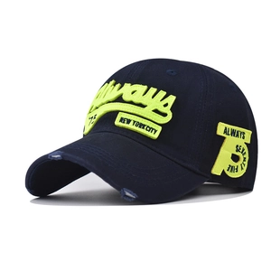 Detailed close-up of neon green 3D embroidery on dark blue cotton baseball cap with distressed brim