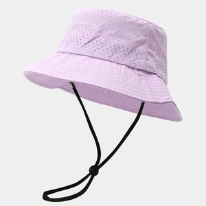 Detail of light purple sun hat featuring breathable laser-cut holes and windproof cord