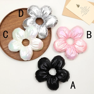 Floral scrunchies in silver, pearl white, pink, and black with a metallic finish
