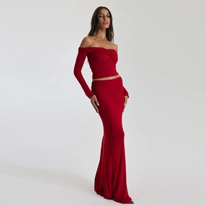 Detail of red two-piece strapless top and maxi skirt set in stretchy knit fabric
