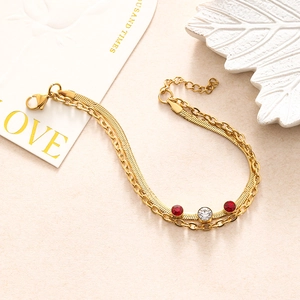 Double-layer gold chain bracelet featuring red and white zircon heart accents