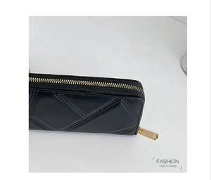 Close-up of black PU leather long wallet featuring quilted rhombic pattern and gold zipper