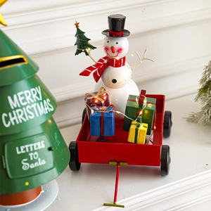 Metal Christmas snowman in red cart with a green Santa mailbox and warm LED lights