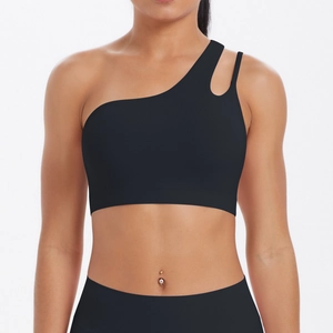 Close-up of black one-shoulder sports bra with asymmetric cut and cutout detail