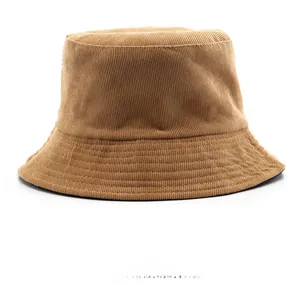 Detailed texture of the caramel brown corduroy fabric on a minimalist bucket hat
