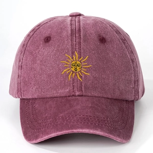 Vintage burgundy washed cotton baseball cap featuring a yellow sun embroidery on the front