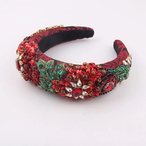Detail of red sponge headband with sequin leaves and rhinestone floral hand-sewn embellishments