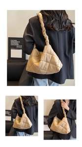 Close-up of quilted cloud bag with scrunchie strap and large capacity texture