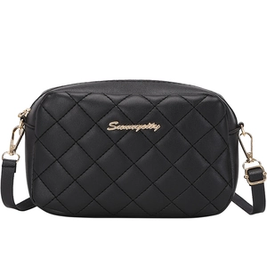 Classic black quilted crossbody bag with gold hardware and adjustable strap on white background