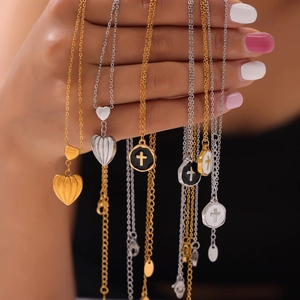 Gold and silver heart pendant necklaces with cross engraved round charms for women