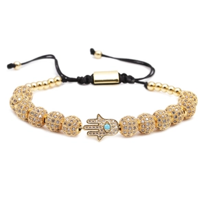 Bracelet Hamsa en cordon noir réglable avec perles dorées en zircone et turquoise bleue
