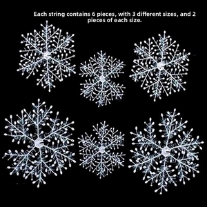 Detail showing 6 white plastic snowflakes in 3 varied sizes for Christmas tree decor