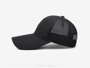 Detail of black mesh baseball cap showing breathable net fabric and long sun visor