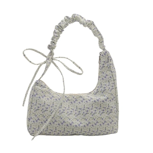 Floral canvas hobo bag with purple flower print and drawstring bow shoulder strap