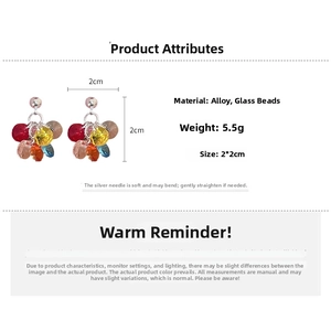 Macro detail of 2x2cm colorful flower stud earrings made of alloy and glass beads
