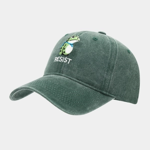 Detailed embroidery of frog and RESIST text on vintage dark green washed cotton cap