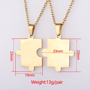 Detail view of gold puzzle piece couple necklaces with size dimensions 23mm and 19mm