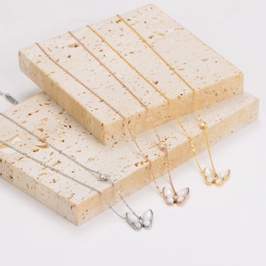 Minimalist stainless steel butterfly necklaces in silver, rose gold, and gold finishes
