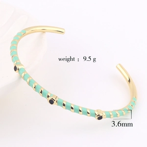 Detail of mint green enamel bangle with 3.6mm width and 9.5g weight specifications